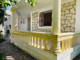 Stone house near the beach in a residential area