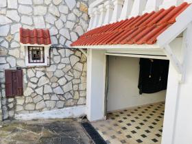 Stone house near the beach in a residential area