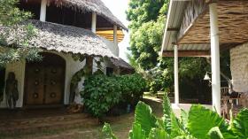 Traditional round villa with makouti roof