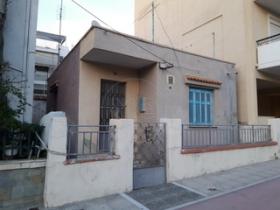 Land with old house in a beautiful place of Athens near the sea